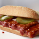 Ilustración para el artículo titulado La verdadera razón por la que McDonalds no vende la McRib durante todo el año
